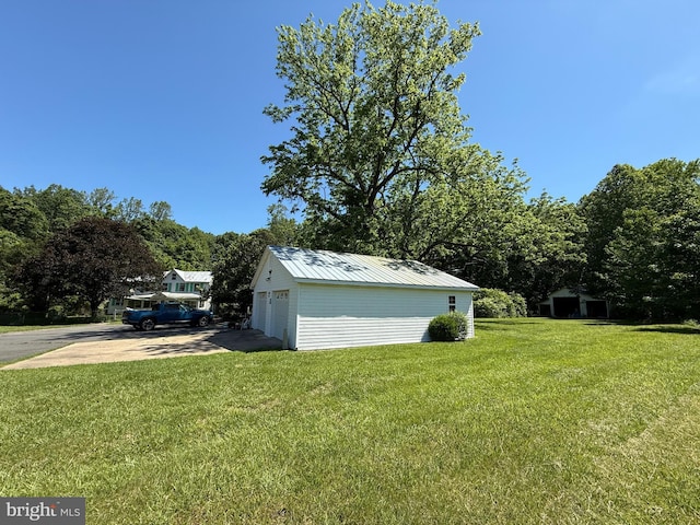 10491 Oak Tree Dr, King George, VA 22485 - view of green lawn featuring an outbuilding and a detached garage