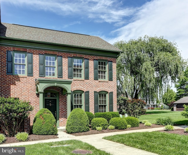 10 Devonshire Sq, Mechanicsburg, PA 17050 - colonial house featuring brick siding, roof with shingles, and a front yard