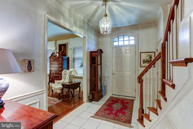 10 Devonshire Sq, Mechanicsburg, PA 17050 - foyer entrance featuring a chandelier, stairs, crown molding, and light tile patterned floors