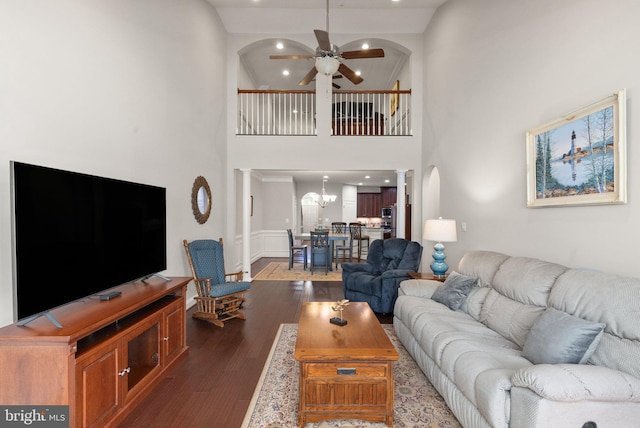 355 Tufton Cir, Fallston, MD 21047 - living room with decorative columns, a ceiling fan, arched walkways, dark wood finished floors, and wainscoting