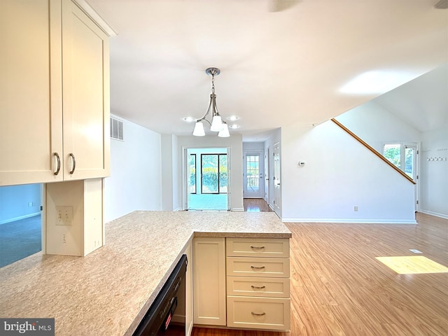 957 Terrapin St Unit 2, Bethany Beach, DE 19930 - kitchen featuring light countertops, a peninsula, dishwasher, a chandelier, and pendant lighting