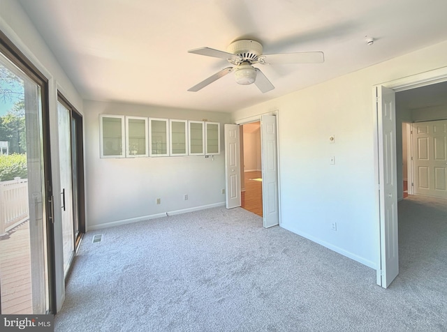 957 Terrapin St Unit 2, Bethany Beach, DE 19930 - unfurnished bedroom featuring light colored carpet, baseboards, and a ceiling fan
