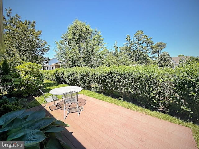 957 Terrapin St Unit 2, Bethany Beach, DE 19930 - wooden deck with outdoor dining area