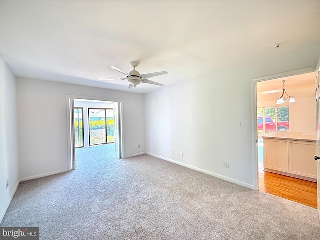 957 Terrapin St Unit 2, Bethany Beach, DE 19930 - spare room with light colored carpet, baseboards, and ceiling fan