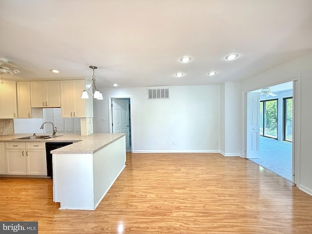 957 Terrapin St Unit 2, Bethany Beach, DE 19930 - kitchen featuring a sink, a peninsula, baseboards, black dishwasher, and recessed lighting