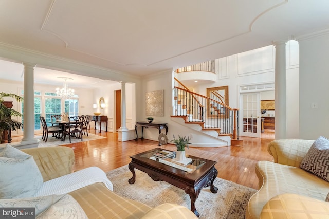 1296 Newkirk Ct, Vienna, VA 22182 - living area featuring ornate columns, wood finished floors, stairs, crown molding, and a chandelier