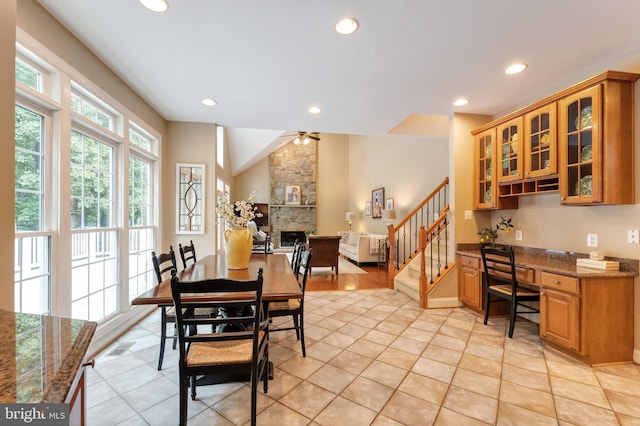 1296 Newkirk Ct, Vienna, VA 22182 - dining room featuring stairway, ceiling fan, recessed lighting, a stone fireplace, and lofted ceiling