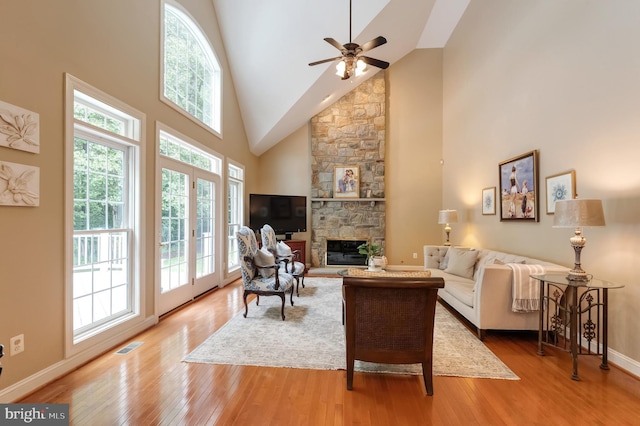 1296 Newkirk Ct, Vienna, VA 22182 - living area with high vaulted ceiling, a stone fireplace, wood finished floors, and ceiling fan