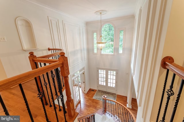 1296 Newkirk Ct, Vienna, VA 22182 - foyer entrance featuring wood finished floors, french doors, ornamental molding, and a chandelier