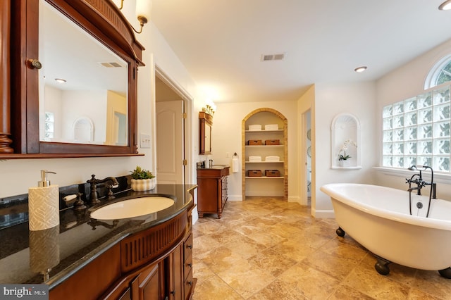 1296 Newkirk Ct, Vienna, VA 22182 - bathroom featuring a freestanding tub, vanity, and recessed lighting