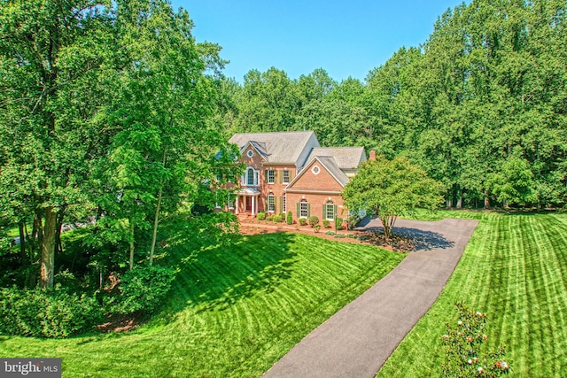 1296 Newkirk Ct, Vienna, VA 22182 - georgian-style home with a front yard and brick siding
