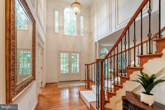 1296 Newkirk Ct, Vienna, VA 22182 - entryway with a chandelier, wood finished floors, stairway, and a towering ceiling
