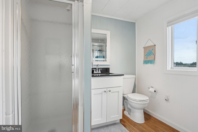398 Kingfisher Rd, Tuckerton, NJ 08087 - bathroom with a stall shower, vanity, wood finished floors, toilet, and crown molding