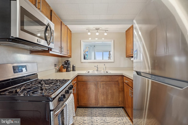 398 Kingfisher Rd, Tuckerton, NJ 08087 - kitchen with stainless steel appliances, a sink, and brown cabinets