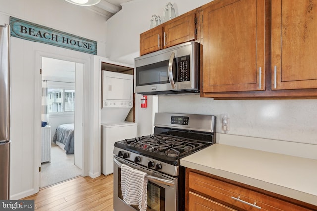 398 Kingfisher Rd, Tuckerton, NJ 08087 - kitchen with stainless steel appliances, light wood-style flooring, light countertops, and brown cabinets
