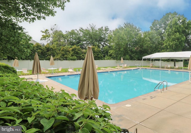 1447 Thornwood Dr, Mount Laurel, NJ 08054 - community pool featuring a fenced backyard, view of scattered trees, and a patio area