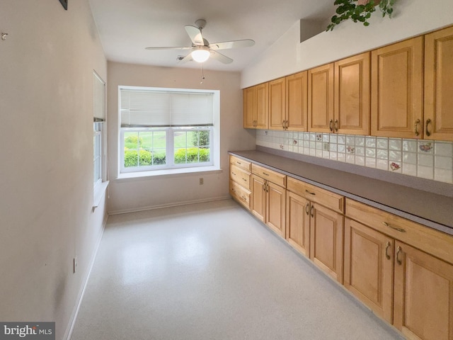 1447 Thornwood Dr, Mount Laurel, NJ 08054 - kitchen with baseboards, tasteful backsplash, a ceiling fan, and dark countertops