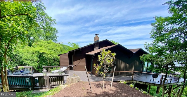 201 Nottingham Hl, Annapolis, MD 21405 - rear view of house featuring a wooden deck and a chimney