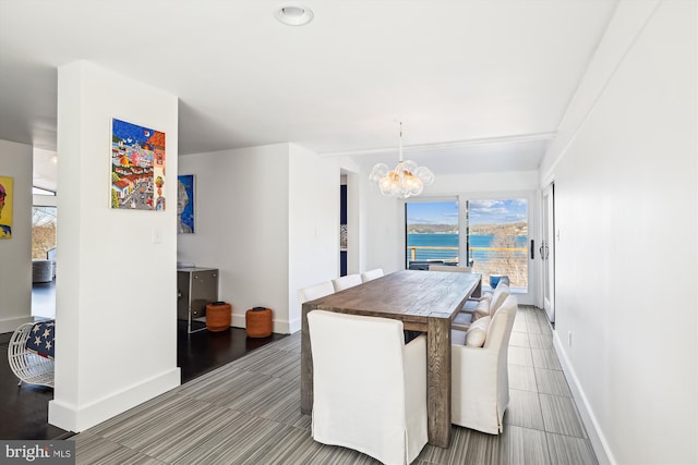 201 Nottingham Hl, Annapolis, MD 21405 - dining area with a chandelier, baseboards, and a water view