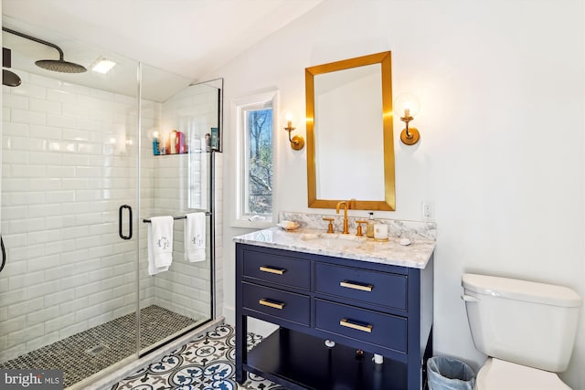 201 Nottingham Hl, Annapolis, MD 21405 - bathroom with lofted ceiling, a stall shower, toilet, vanity, and tile patterned flooring
