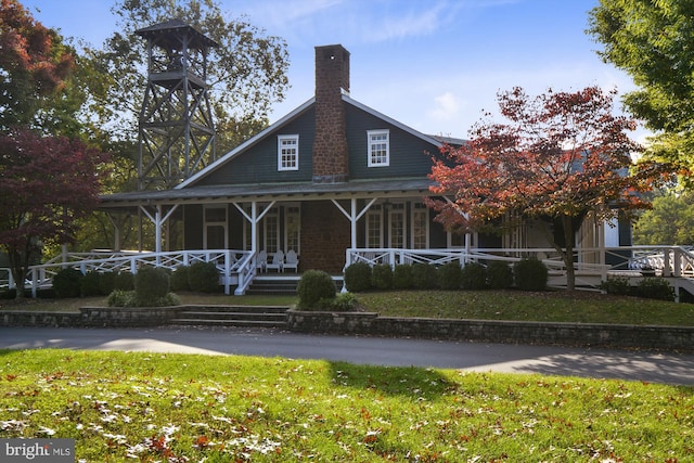 201 Nottingham Hl, Annapolis, MD 21405 - view of front facade with covered porch, a chimney, and a front yard