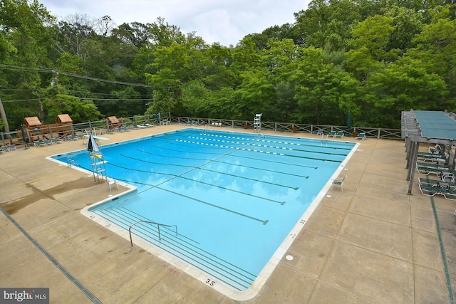 201 Nottingham Hl, Annapolis, MD 21405 - community pool featuring a view of trees and a patio area