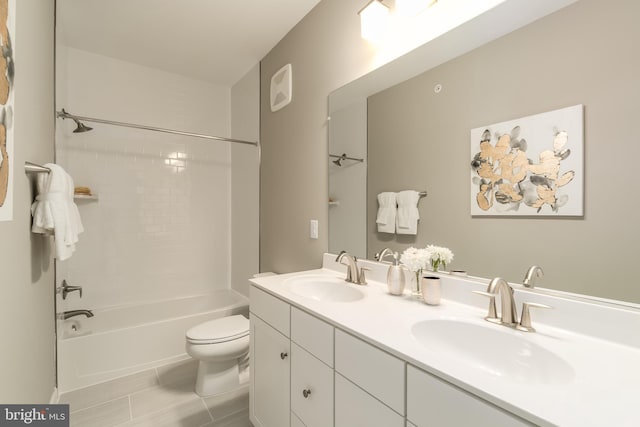 full bath featuring toilet, double vanity, shower / bathtub combination, and tile patterned floors