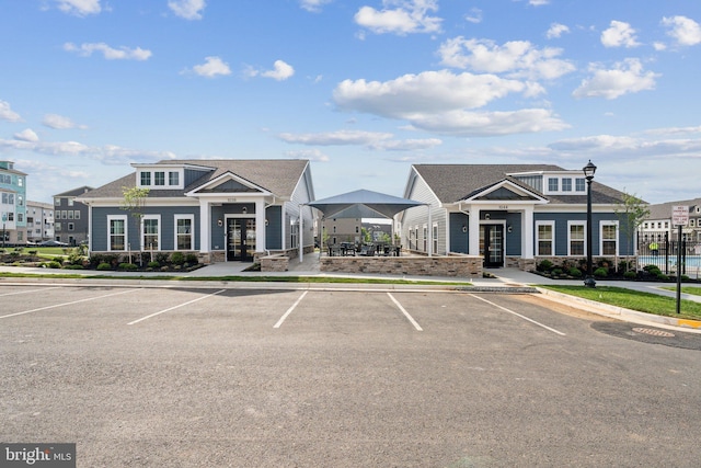 view of building exterior featuring uncovered parking