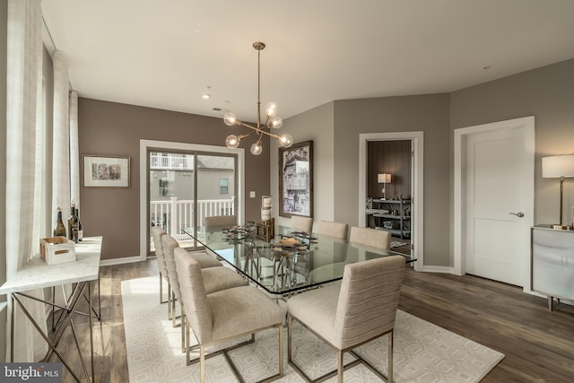 dining area featuring wood finished floors, a chandelier, baseboards, and recessed lighting