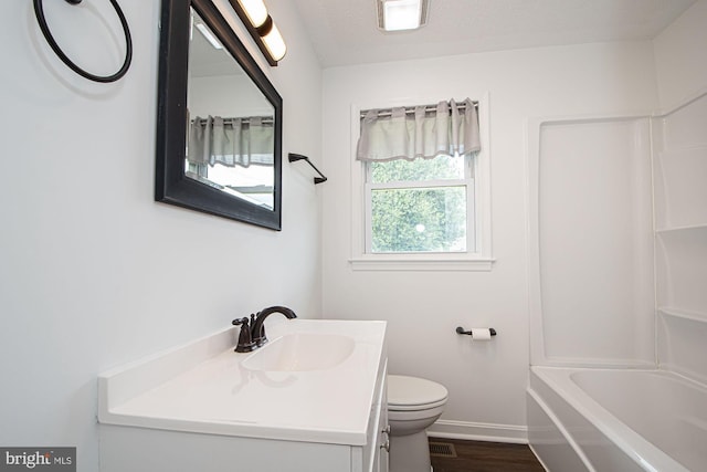 126 Clymer Ave, Front Royal, VA 22630 - bathroom featuring toilet, vanity, baseboards, shower / bath combination, and wood finished floors