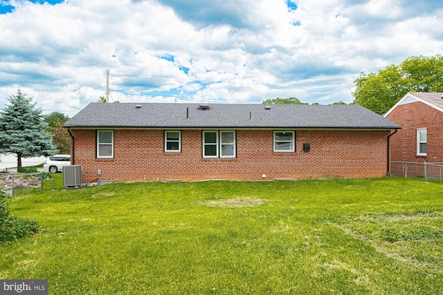 126 Clymer Ave, Front Royal, VA 22630 - rear view of property featuring cooling unit, brick siding, and roof with shingles