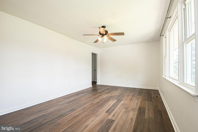 126 Clymer Ave, Front Royal, VA 22630 - unfurnished room with dark wood-style floors, baseboards, a ceiling fan, and a textured ceiling