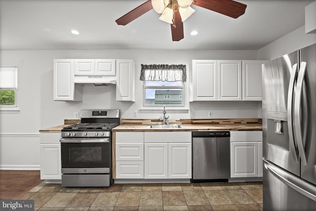 12 Constitution Rd, Clementon, NJ 08021 - kitchen with appliances with stainless steel finishes, under cabinet range hood, a sink, wood counters, and recessed lighting