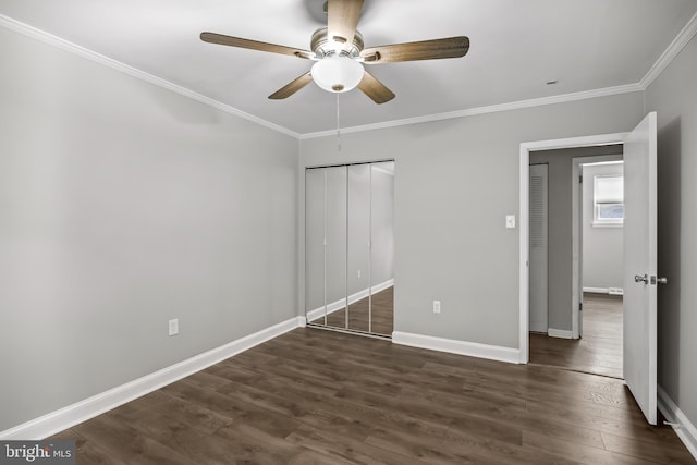 12 Constitution Rd, Clementon, NJ 08021 - unfurnished bedroom with dark wood-style flooring, crown molding, baseboards, a closet, and a ceiling fan