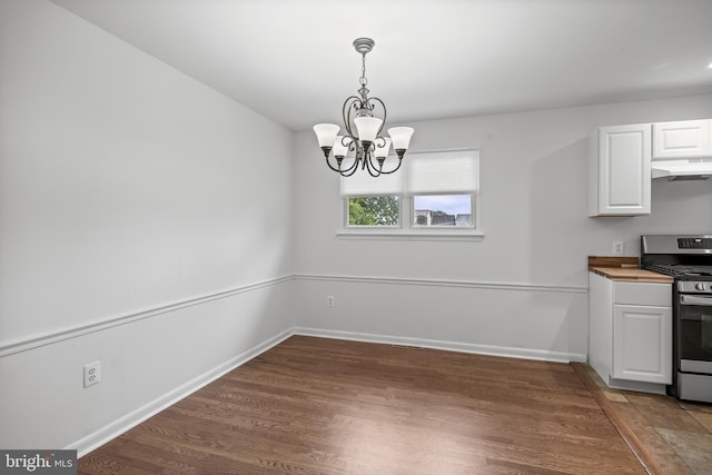 12 Constitution Rd, Clementon, NJ 08021 - unfurnished dining area with a chandelier, wood finished floors, and baseboards