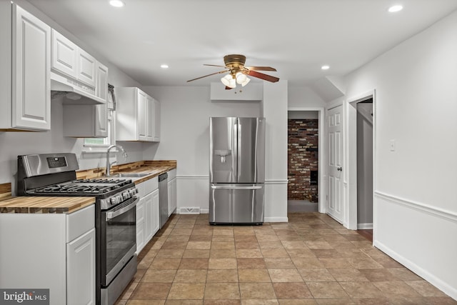 12 Constitution Rd, Clementon, NJ 08021 - kitchen featuring appliances with stainless steel finishes, under cabinet range hood, a ceiling fan, a sink, and white cabinets