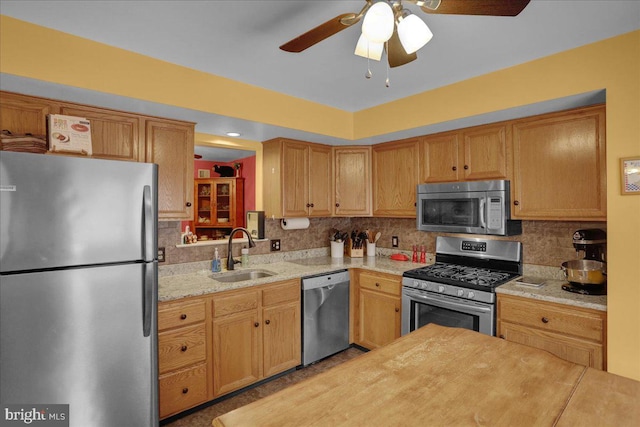 3919 Penns Dr, Reading, PA 19606 - kitchen with stainless steel appliances, a sink, decorative backsplash, and ceiling fan