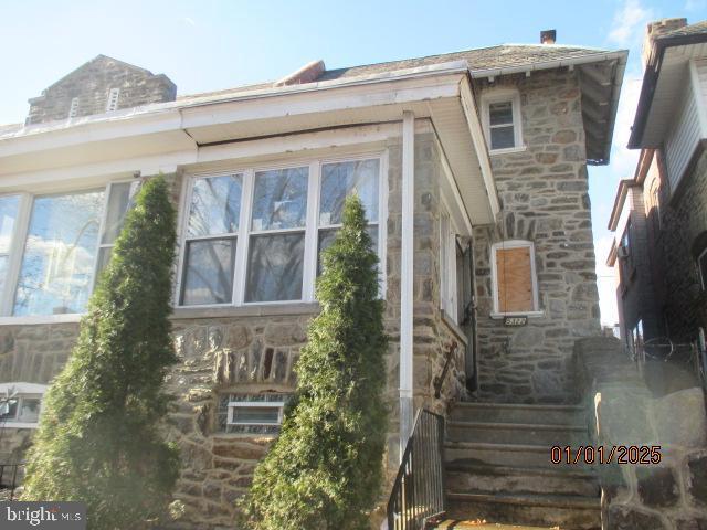 5322 N Carlisle St, Philadelphia, PA 19141 - view of home's exterior featuring stone siding