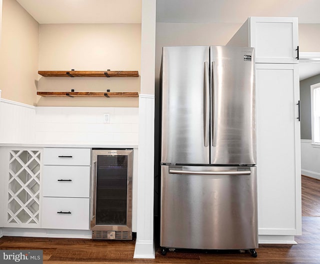 803 Essex Ave, Essex, MD 21221 - kitchen featuring freestanding refrigerator, beverage cooler, white cabinets, open shelves, and dark wood-style flooring