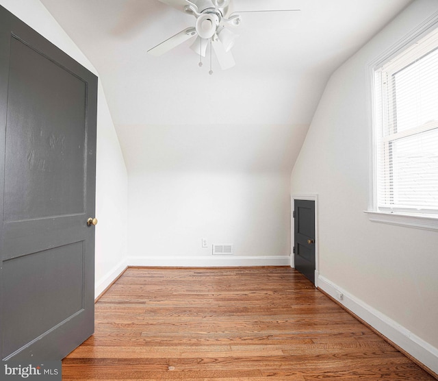 803 Essex Ave, Essex, MD 21221 - additional living space with vaulted ceiling, ceiling fan, baseboards, and light wood-type flooring