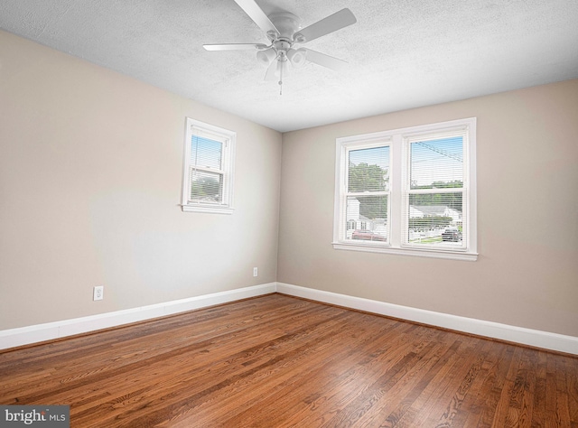 803 Essex Ave, Essex, MD 21221 - spare room featuring baseboards, a textured ceiling, wood finished floors, and a ceiling fan