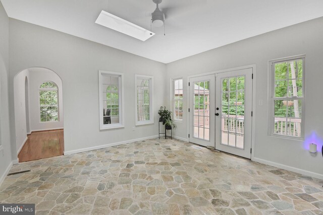 310 Owings Hill Ct, Owings, MD 20736 - spare room with stone flooring, ceiling fan, baseboards, french doors, and vaulted ceiling