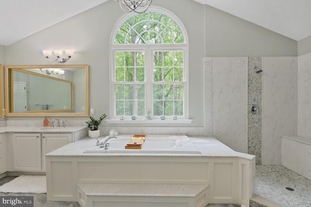 310 Owings Hill Ct, Owings, MD 20736 - bathroom featuring vaulted ceiling, a bath, tiled shower, and a chandelier