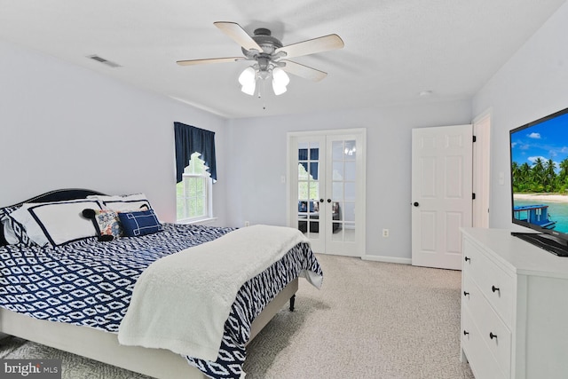 310 Owings Hill Ct, Owings, MD 20736 - bedroom with french doors, light carpet, a ceiling fan, and baseboards