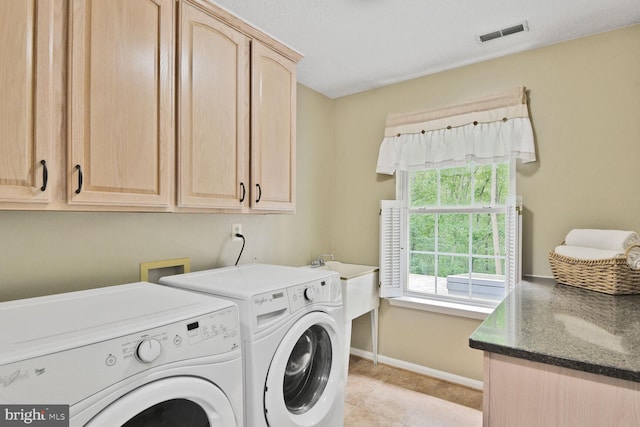 310 Owings Hill Ct, Owings, MD 20736 - washroom with cabinet space, washer and dryer, and baseboards