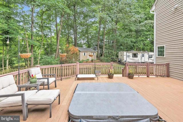 310 Owings Hill Ct, Owings, MD 20736 - wooden deck featuring a hot tub and view of wooded area