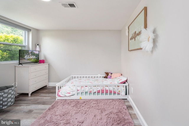 13713 Mayfair Ct, Woodbridge, VA 22193 - bedroom with wood finished floors and baseboards