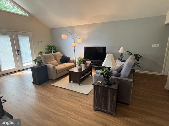 21 Moby Dick Dr, Ocean Pines, MD 21811 - living room featuring wood finished floors, french doors, and lofted ceiling