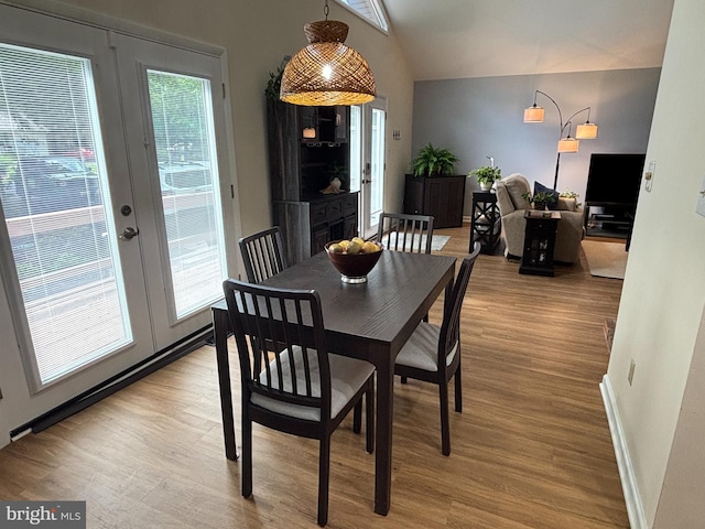 21 Moby Dick Dr, Ocean Pines, MD 21811 - dining space featuring lofted ceiling, light wood-type flooring, baseboards, and french doors