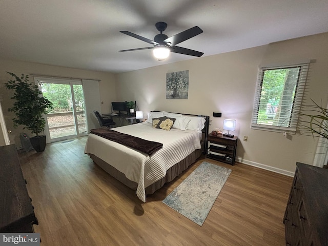 21 Moby Dick Dr, Ocean Pines, MD 21811 - bedroom with access to outside, wood finished floors, baseboards, and a ceiling fan